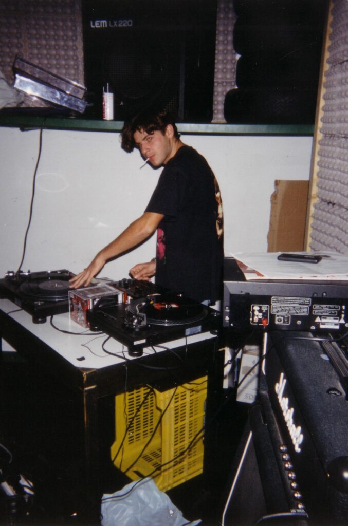 DJ Gino Tonico performing with turntables in the 1990s