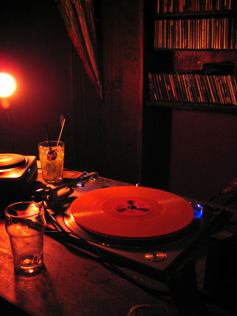 DJ Gino Tonico performing with turntables in the 2000s