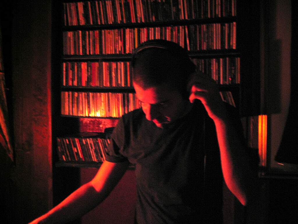 DJ Gino Tonico performing with turntables in the 2000s