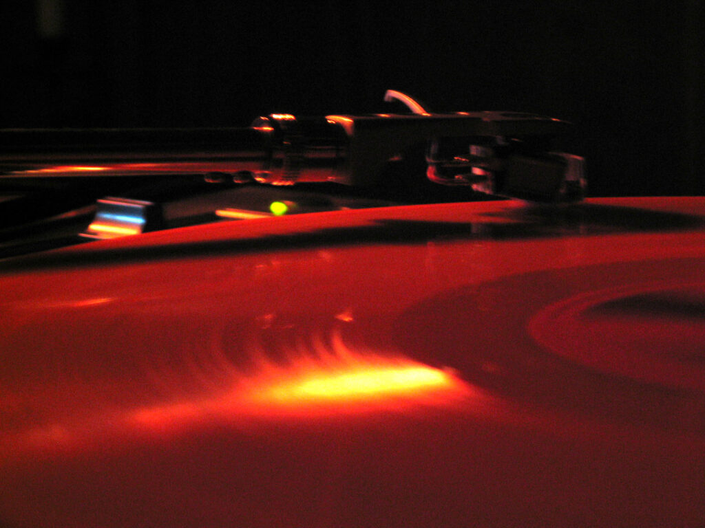 DJ Gino Tonico performing with turntables in the 2000s